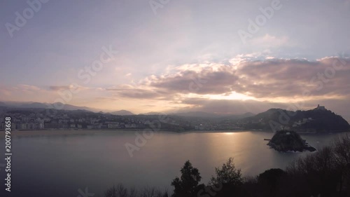 Wallpaper Mural Time lapse footage of romantic sunset over San Sebastian skyline, bay and ocean. Torontodigital.ca