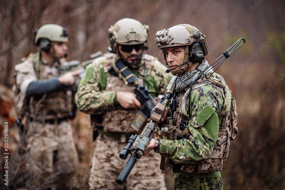 Fototapeta premium soldiers or private military contractors aiming with rifle. war, army, weapon, technology and people concept.