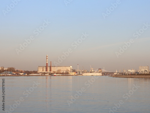 a wide river in the city in the spring evening