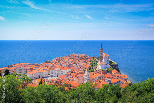 Фотография View of the Adriatic Sea and the tiled roofs of Piran, Slovenia