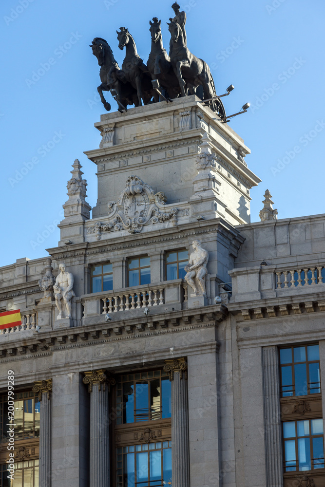 Building with Sculpture of a chariot at Alcala street in city of Madrid, Spain