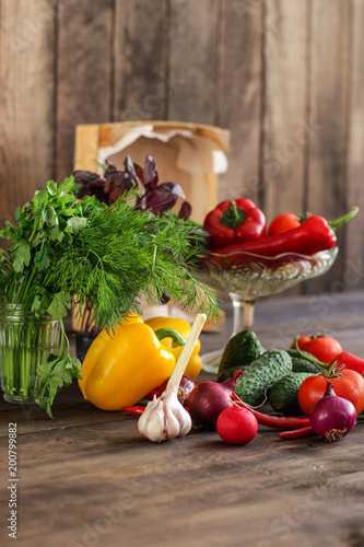 Fototapeta Naklejka Na Ścianę i Meble -  vegetables - a set of ingredients for salad (tomato, cucumber, radish, pepper, arugula, basil, parsley, dill, herbs, herbs, radish and others)