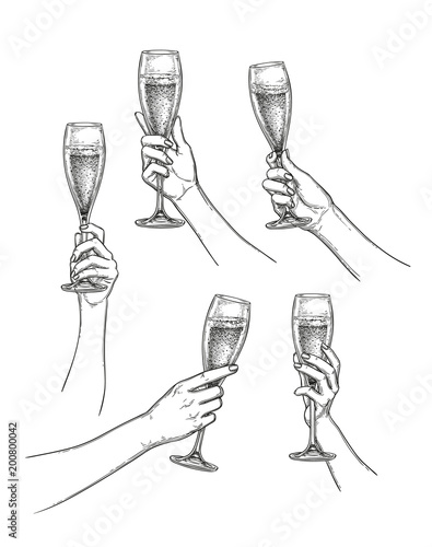 Set of hands with champagne glasses