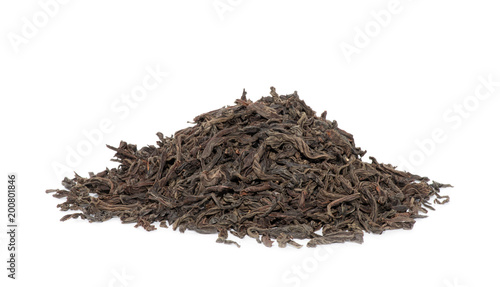 dry black tea leaves isolated on white