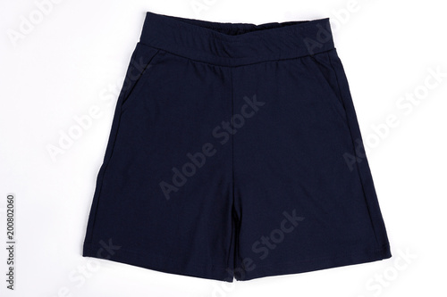 Toddler boy dark cotton shorts. Close up of casual textile shorts for infant boy. High quality childrens summer apparel on sale.
