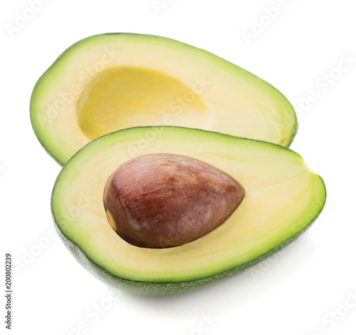 two halves of avocado isolated on white background