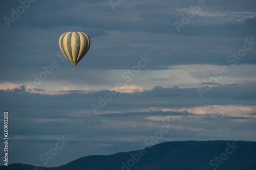Hot air balloon over savanna hills © Herr Loeffler