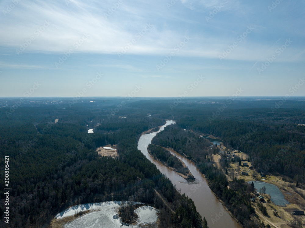 drone image. aerial view of frozen riverbank in spring, Gauja, Latvia
