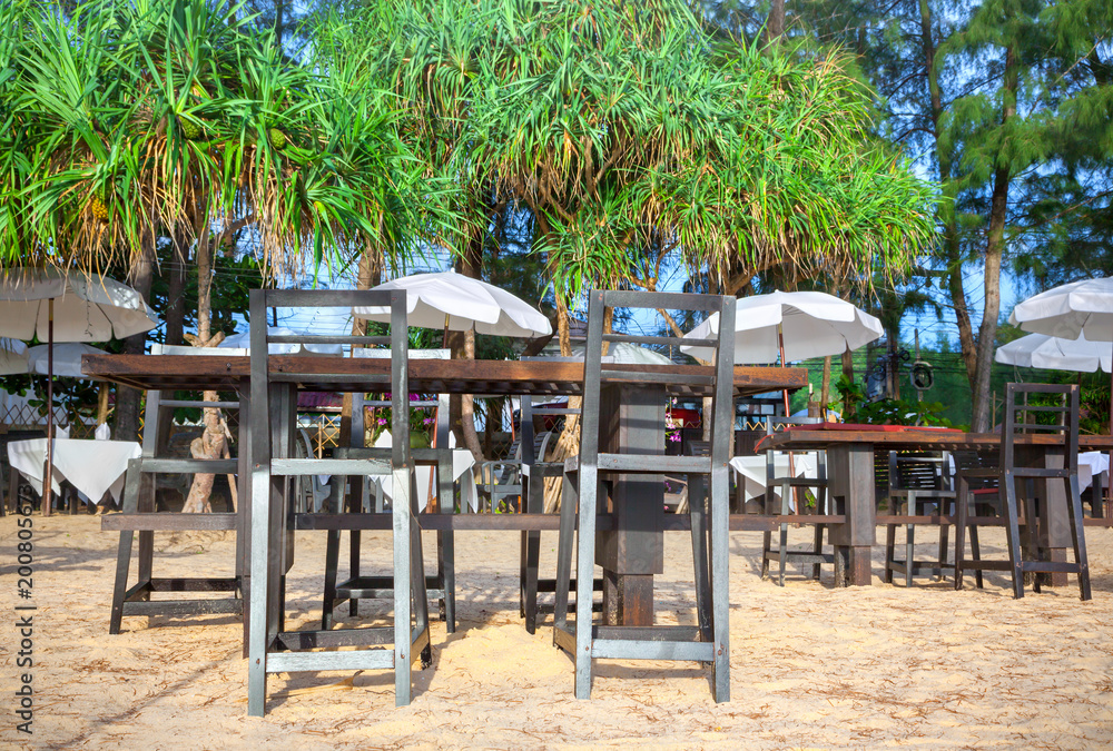 Tables with chairs on the beach