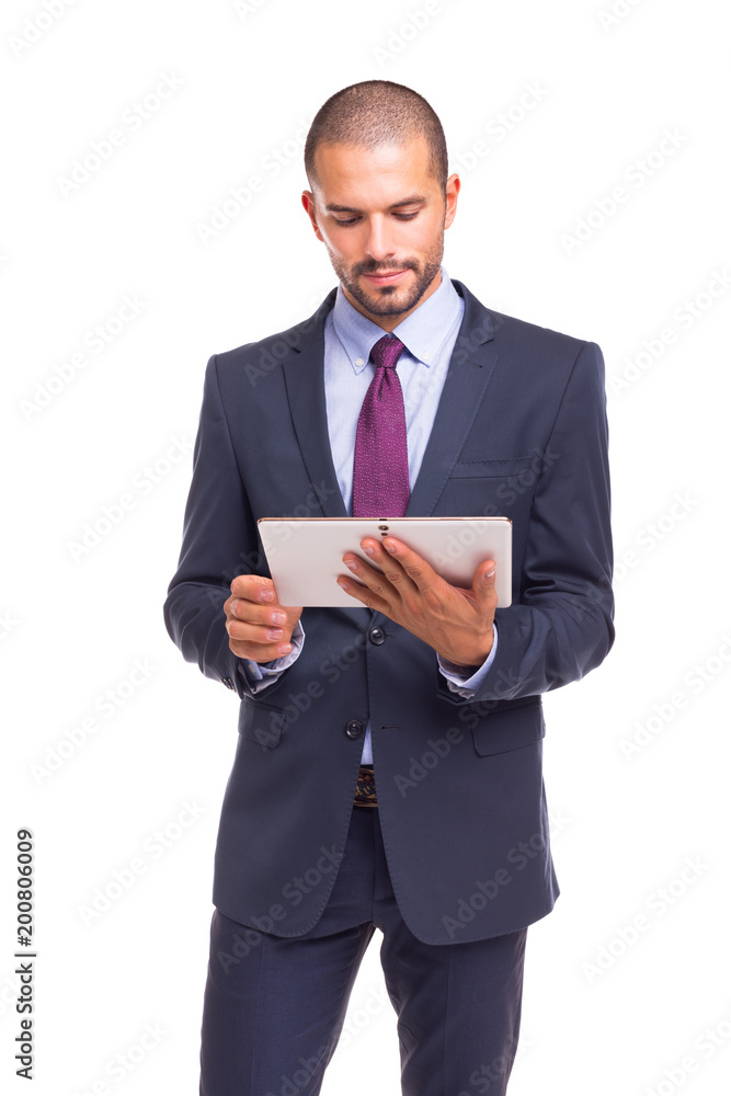 Handsome business man looking to tablet computer, isolated over white background Handsome business man looking to tablet computer, isolated over white background