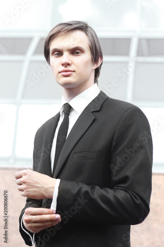 portrait of a young businessman on blurred background