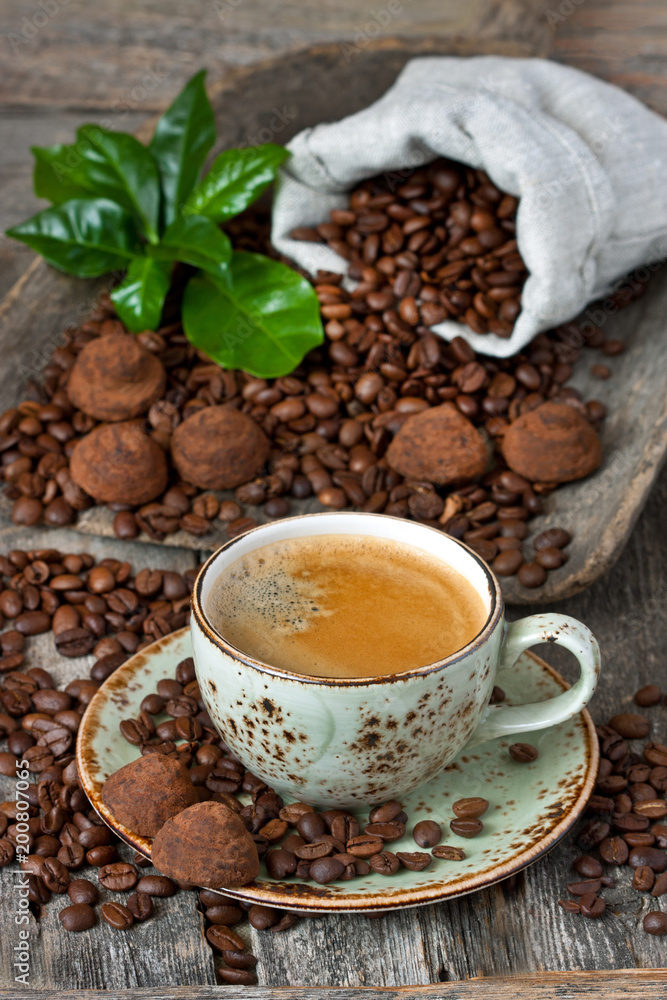 Chocolate truffles and cup of aromatic coffee Chocolate truffles and cup of aromatic coffee