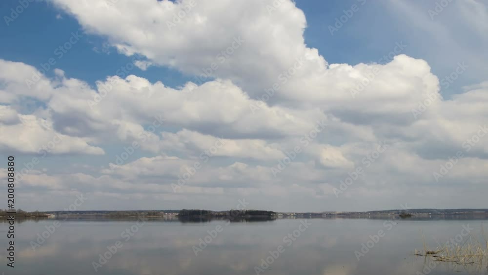 Clouds over the lake, timelapse 4K. The movement of clouds over a spring lake.
Clouds over the lake, timelapse 4K. The movement of clouds over a spring lake.
