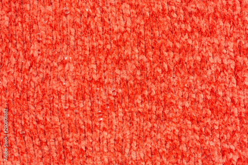 background of knitted chenille yarn in red