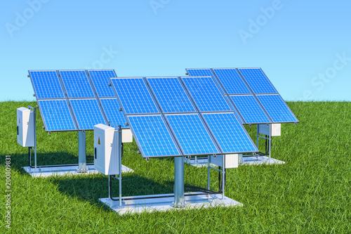 Renewable energy concept. Solar panels in the green grass against blue sky, 3d rendering