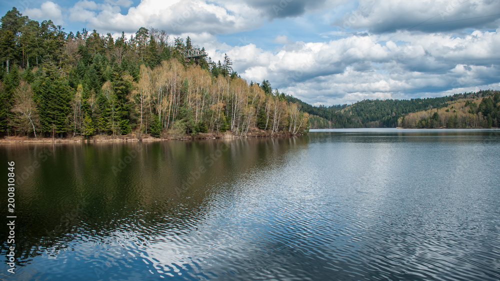 Obraz premium Panorama of beautiful lake on spring with cloudu sky