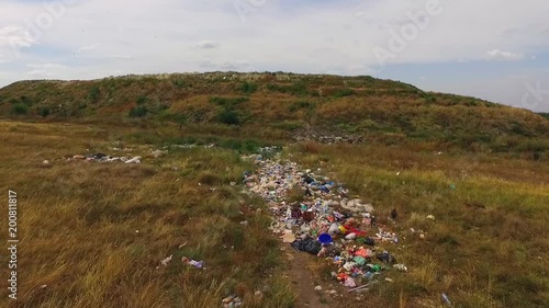 garbage is dropped in front of the hill