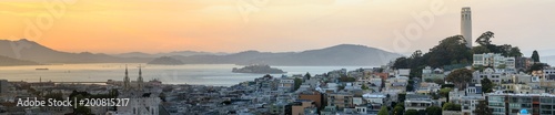 Sunset panoramic views of Telegraph Hill and North Beach neighborhoods with San Francisco Bay, Alcatraz and Angel Islands as well as Marin Headlands. San Francisco, California, USA.
