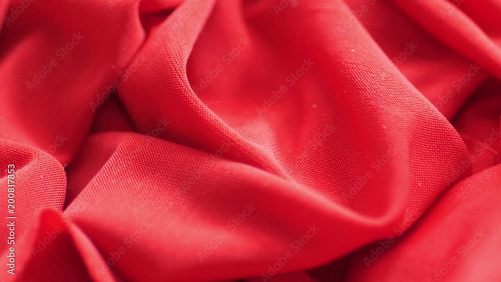 Red satin fabric background, slow motion Red satin fabric background, slow motion
