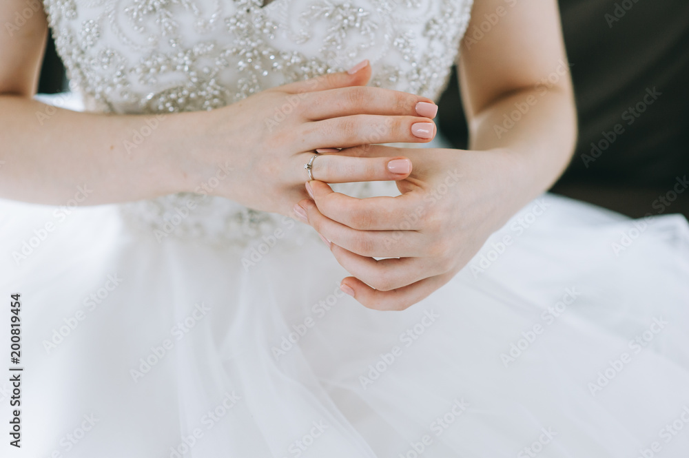 The bride is in a white dress with a wedding dress The bride is in a white dress with a wedding dress