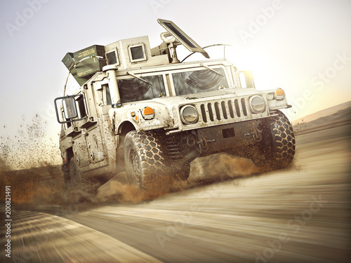 Military armored vehicle moving at a high rate of speed with motion blur over sand. Generic 3d rendering scene. © Digital Storm