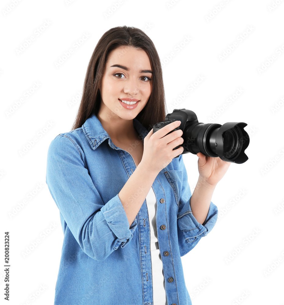 Female photographer with camera on light background Female photographer with camera on light background