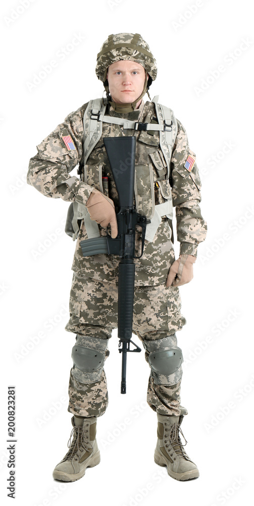 Fototapeta premium Male soldier with machine gun on white background. Military service
