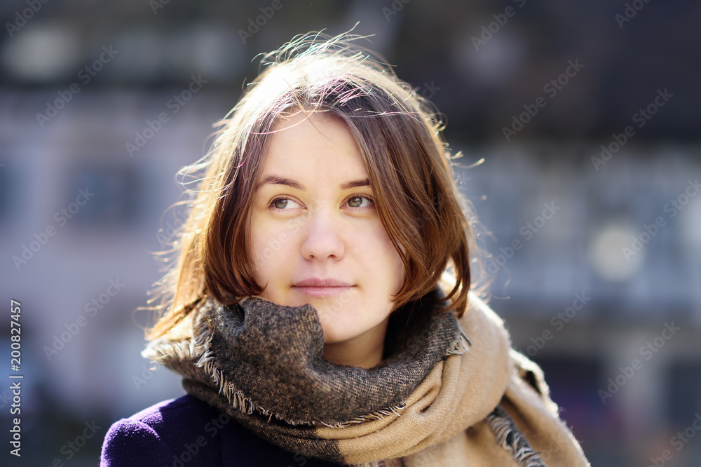 Close-up portrait of pretty young girl outdoors in sunny spring day Close-up portrait of pretty young girl outdoors in sunny spring day