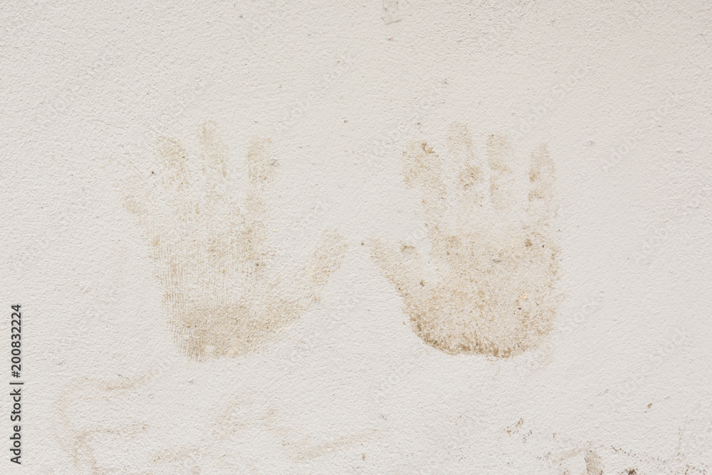 dirty handprints stained on wall