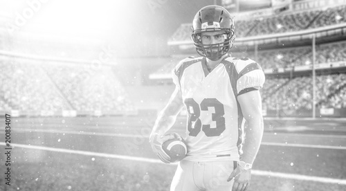 American Football Player isolated on big modern stadium field