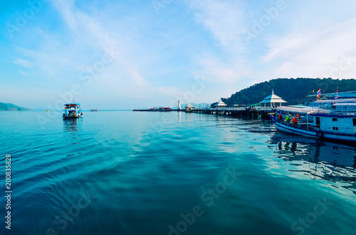 The blue surface of the sea and the ship going into the distance. Tourist vessel. Tylang, Bang Bao