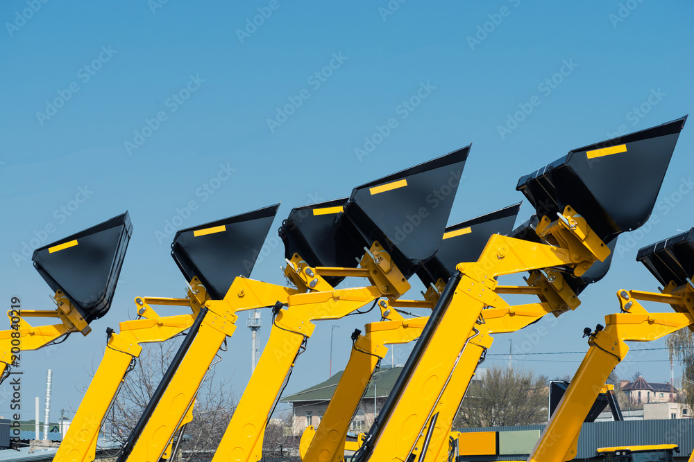 Close-up construction scoop against the sky. Close-up construction scoop against the sky.