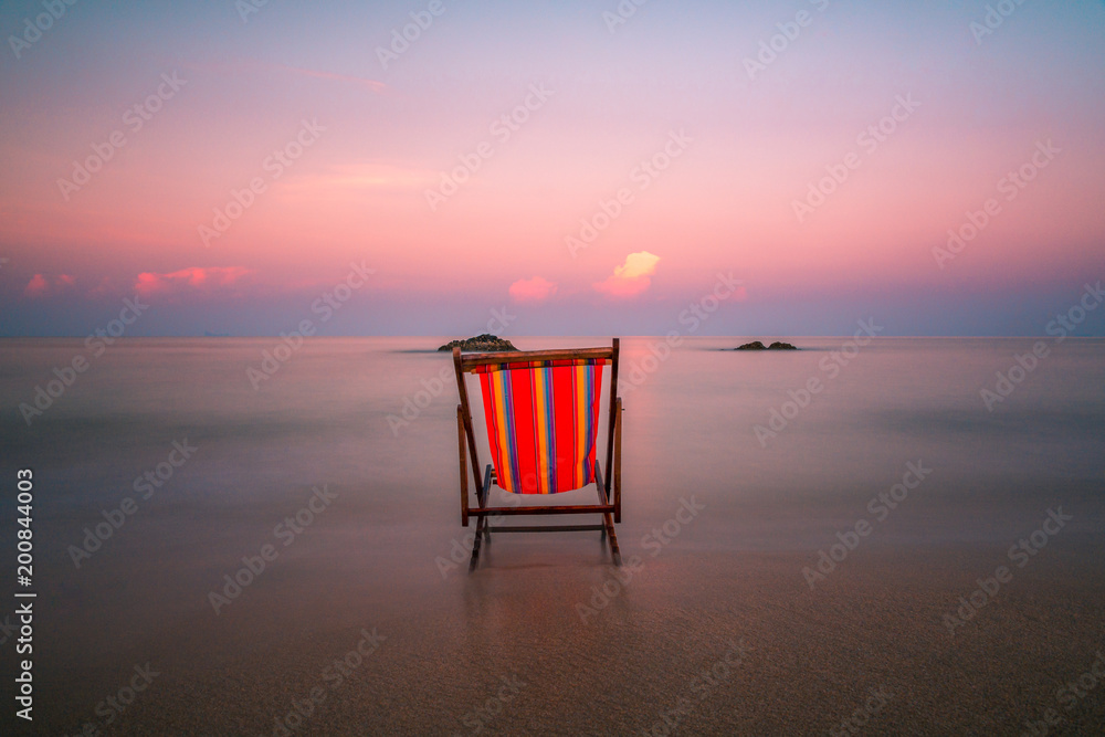 Stunning long exposure shot of a beach chair in the clear waters of Andaman  sea at Koh Lanta Island in Krabi, Thailand. Stock Photo | Adobe Stock