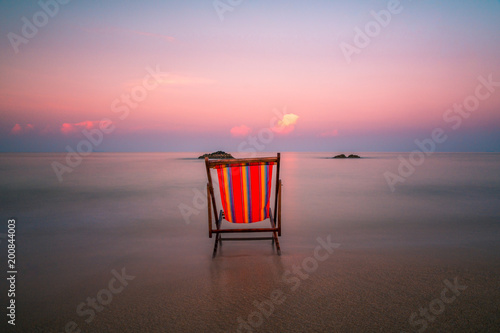 Stunning long exposure shot of a beach chair in the clear waters of Andaman sea at Koh Lanta Island in Krabi  Thailand.