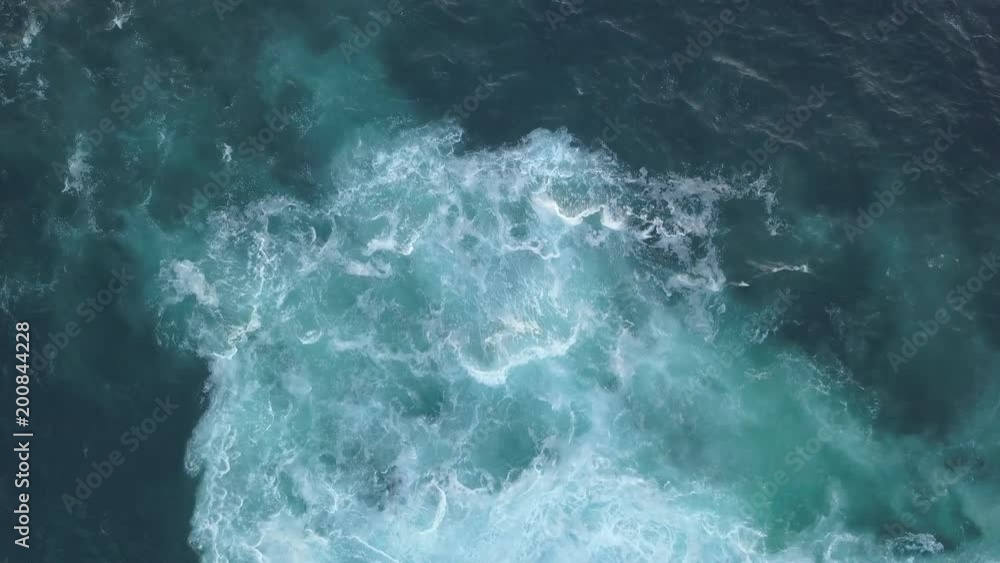 Aerial view of blue water and white foam. Aerial view of blue water and white foam.