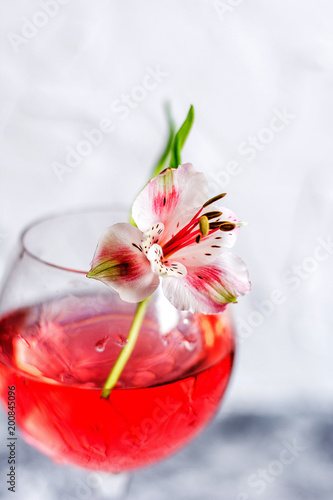 Red cocktail with flowers. Nikerboker.Rom with cranberries