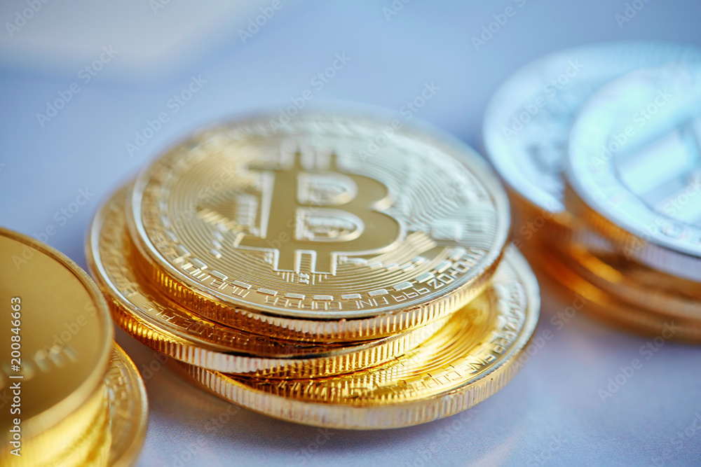Bitcoin cryptocurrency on the chart background, close-up, shallow depth of field Bitcoin cryptocurrency on the chart background, close-up, shallow depth of field