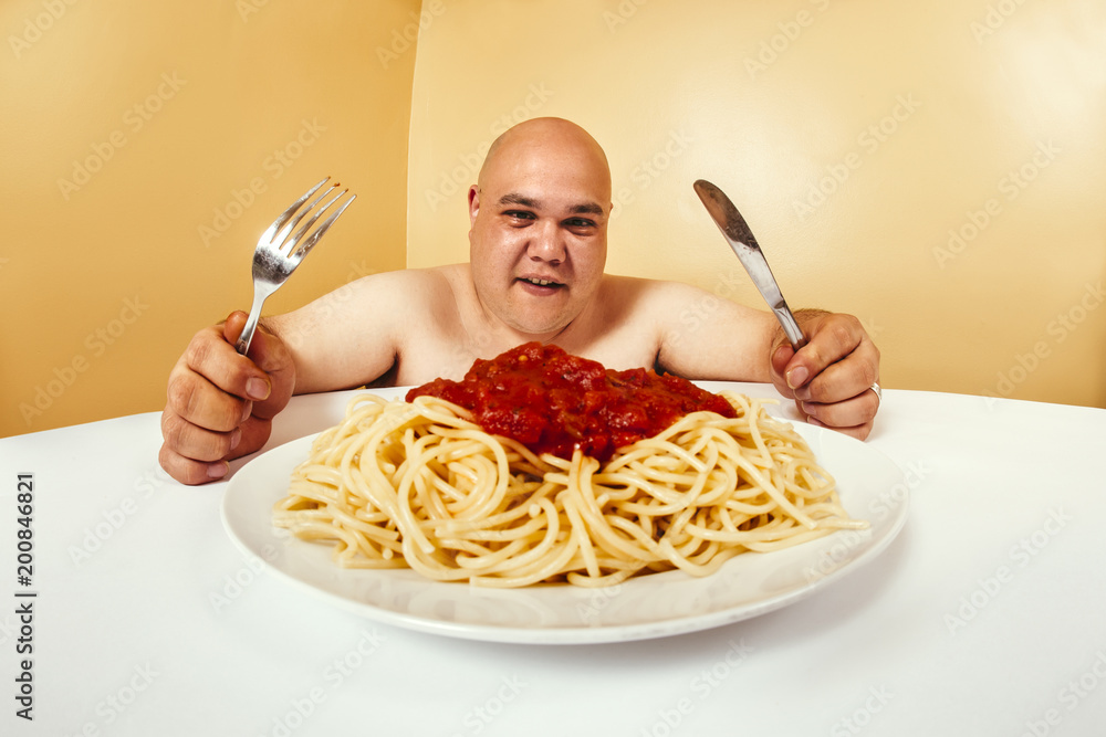 Hungry fat man eating spaghetti Stock Photo Adobe Stock