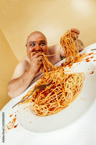 Photography Crazy man eating plate of spaghetti