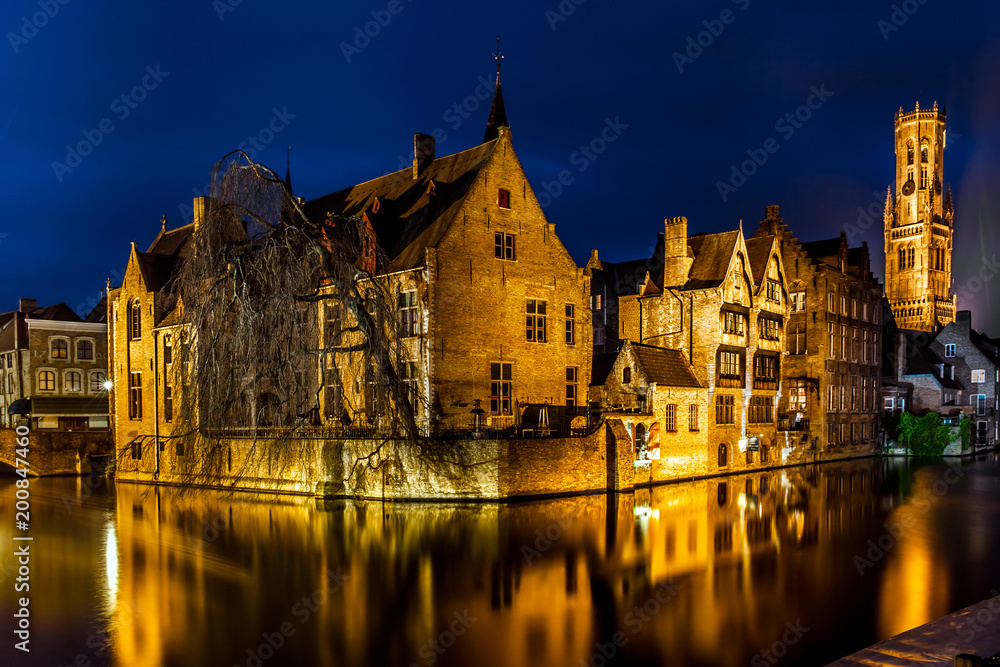Night view of famous Bruges city view, Belgium, nightshot of Brugge canals, houses on Belfry canal Night view of famous Bruges city view, Belgium, nightshot of Brugge canals, houses on Belfry canal