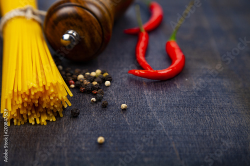 Spaghetti on a dark wooden background