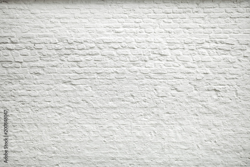 Texture of old dark white blocks, brick wall background.