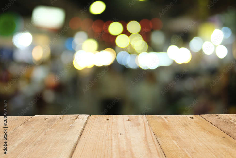 Empty wooden table of brown on front blurred colorful bokeh background, for used template and presentation