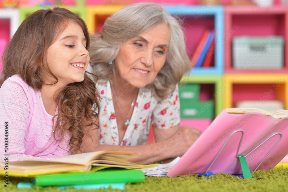 girl and grandmother doing homework girl and grandmother doing homework