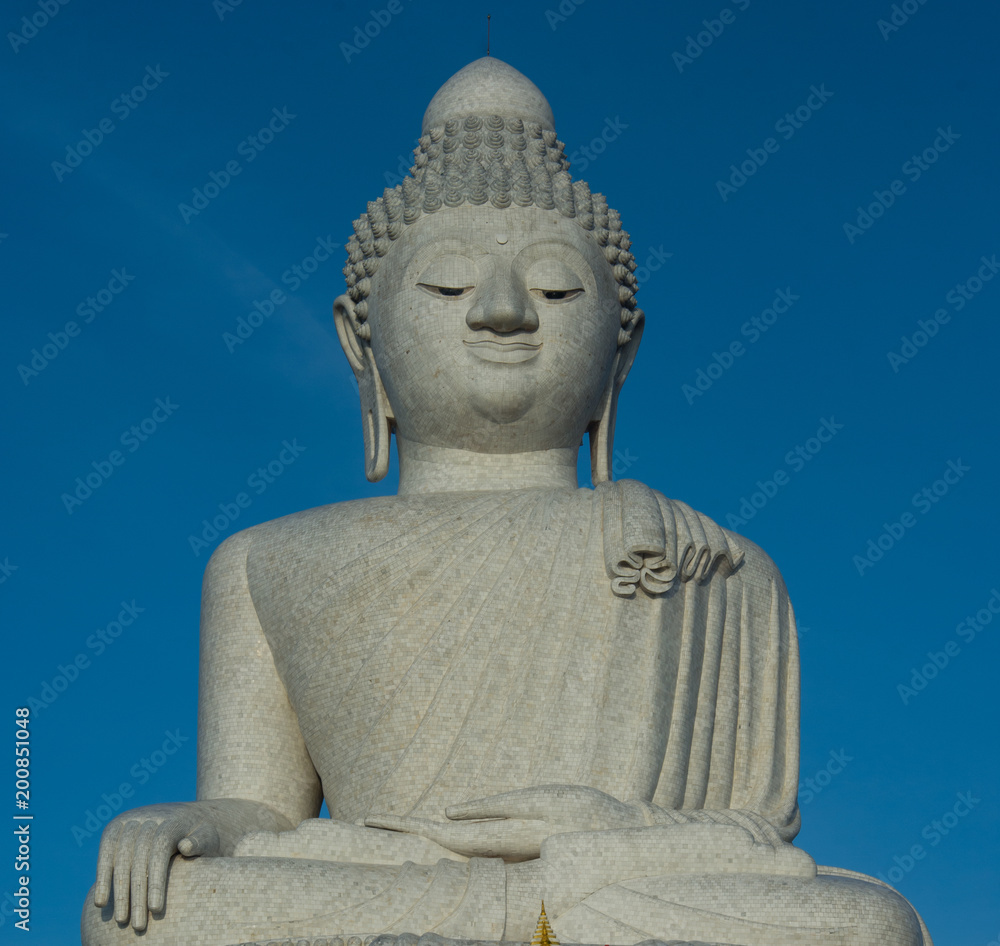 Big buddah close-up, phuket over clear blue sky Big buddah close-up, phuket over clear blue sky