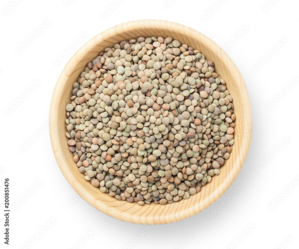 Natural organic lentils in a wooden bowl. Top view. Natural organic lentils in a wooden bowl. Top view.
