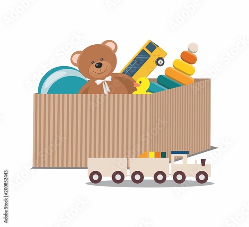 Kids toys concept. Teddy Bear and clorful toys, wooden toy train in paper box	
