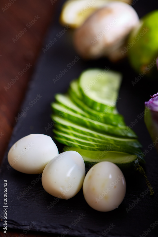 Breakfast still life with sandwiches, quail eggs, spicies and fresh fruits and vegetables, selective focus Breakfast still life with sandwiches, quail eggs, spicies and fresh fruits and vegetables, selective focus