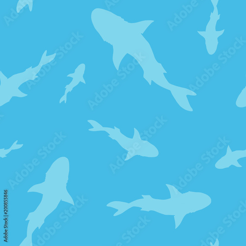 Vector seamless pattern of shark fish silhouette on blue background