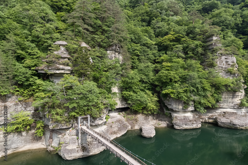Fototapeta premium To-no-Hetsuri , A spectacular sight of a carved rock face millions of years in the making. To no Hetsuri is a popular sightseeing spot in Fukushima Prefecture.
